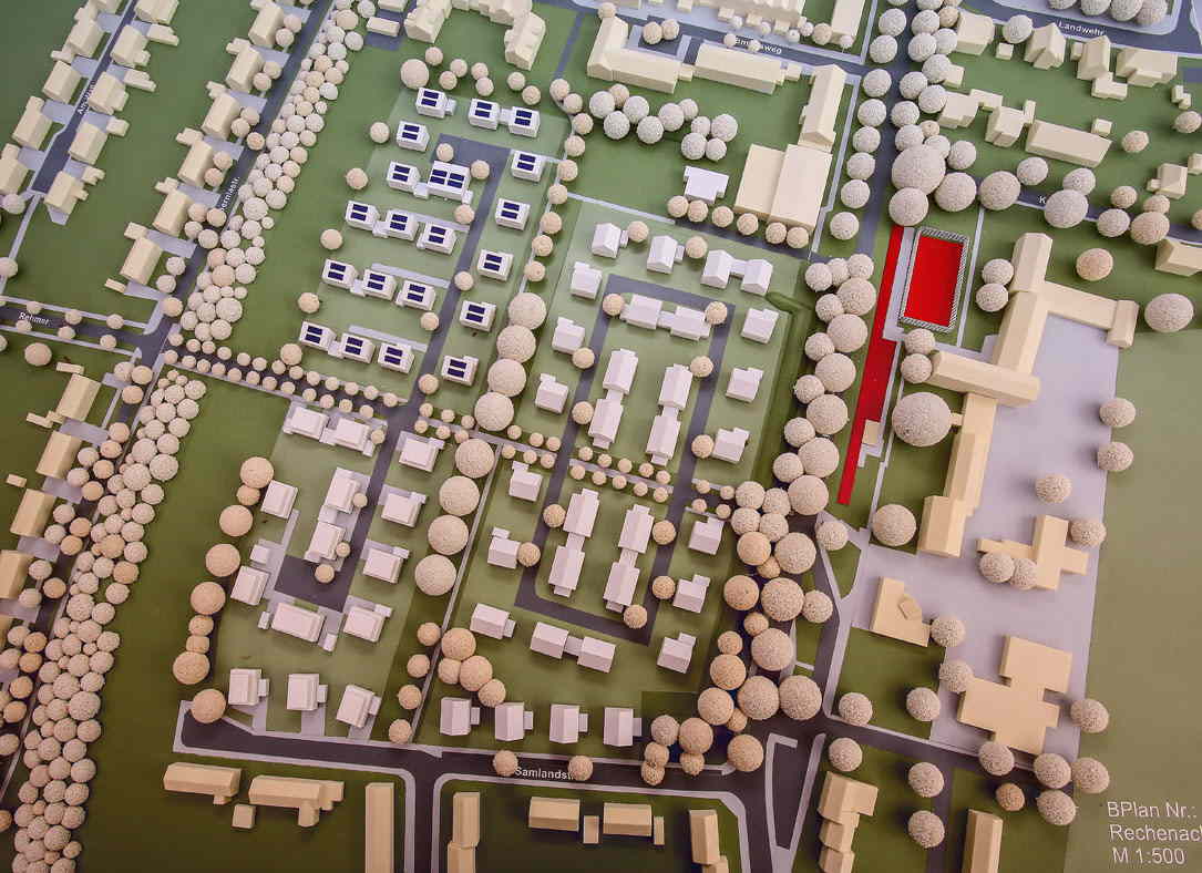 Aus der Vogelperspektive sieht man ein Modell von einer Nachbarschaft. Das Modell repräsentiert eine perfekte Quartiersloesung für Wohngegenden. 